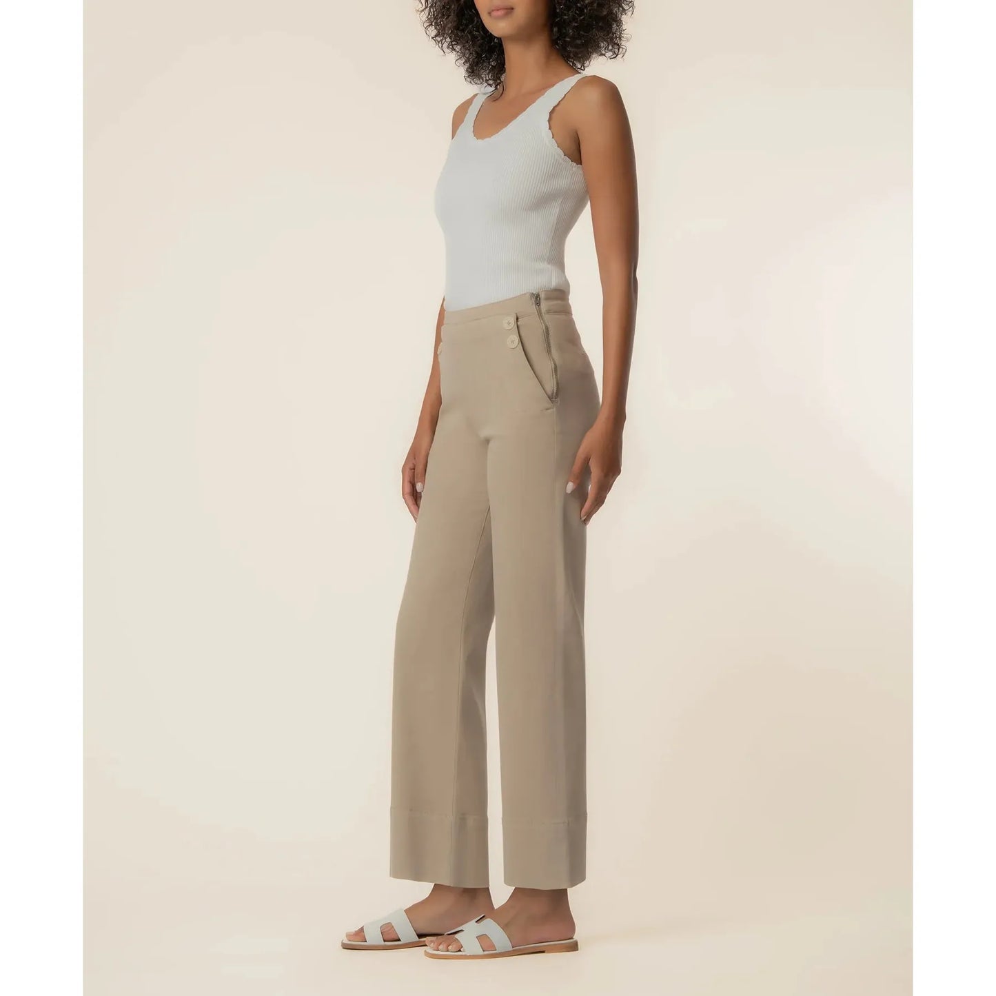Side profile of the Charlotte wide leg pant showing the smooth side-zip closure and tailored hip fit.