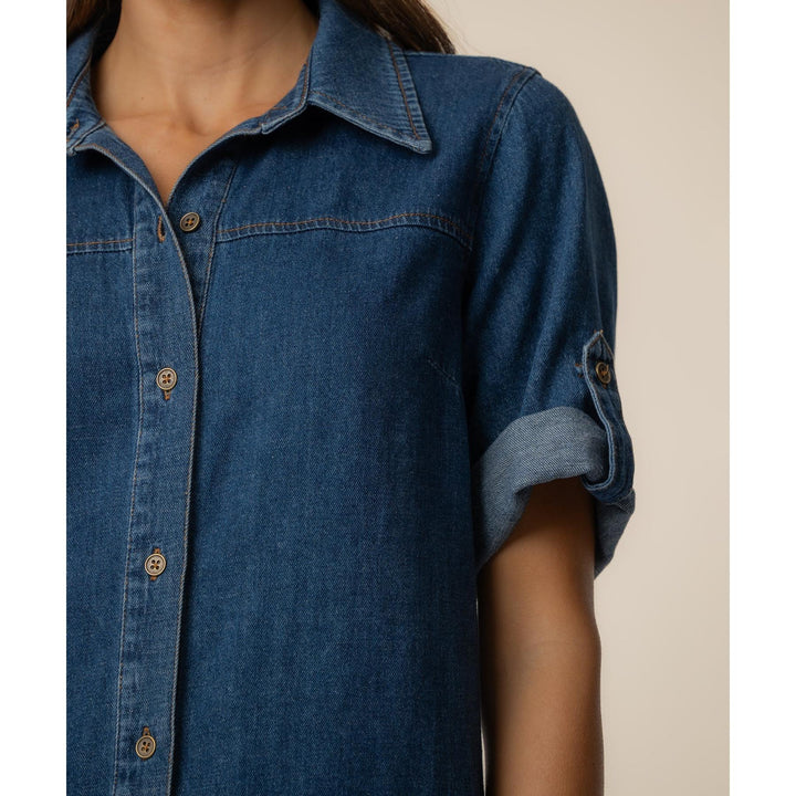 Close-up of the cotton-linen denim fabric, flap pockets, and button-down collar detail.