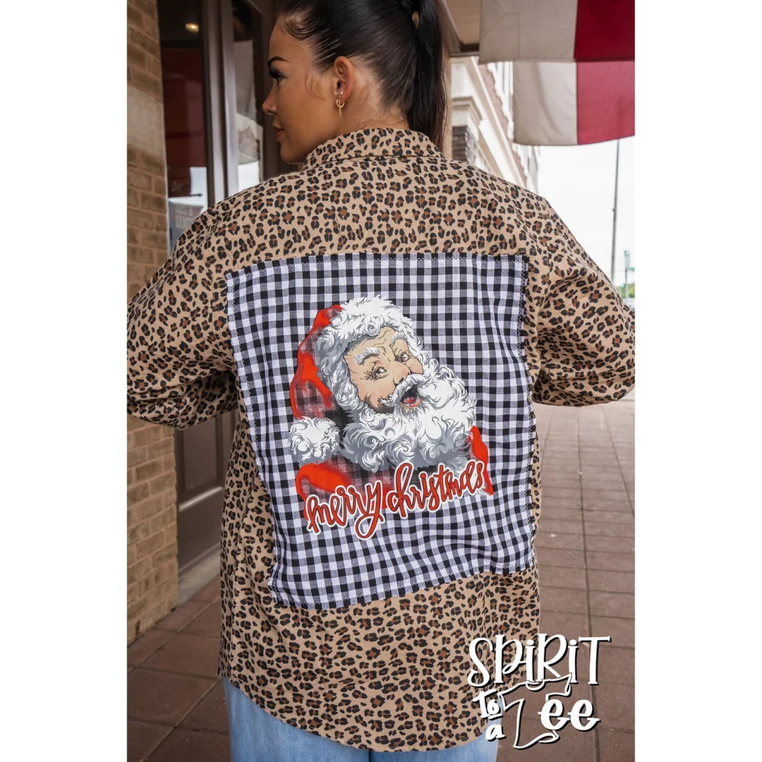 Close-up of the vintage Santa head patch on the back of the brown animal print flannel.
