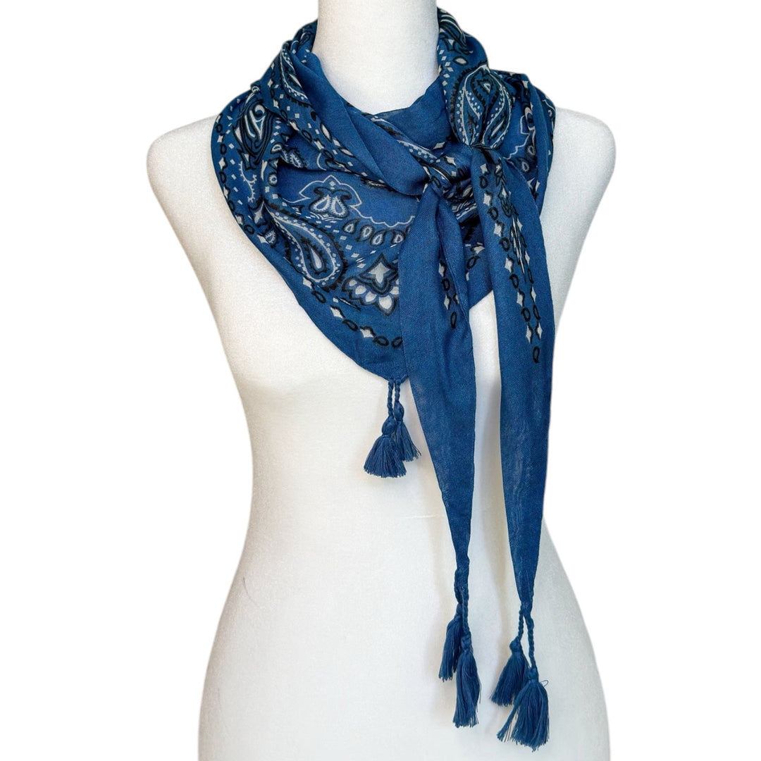 Winton and Waits denim blue tassel bandana styled as a scarf on a mannequin.