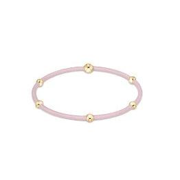 enewton essentials light pink hair tie bracelet with gold beads.