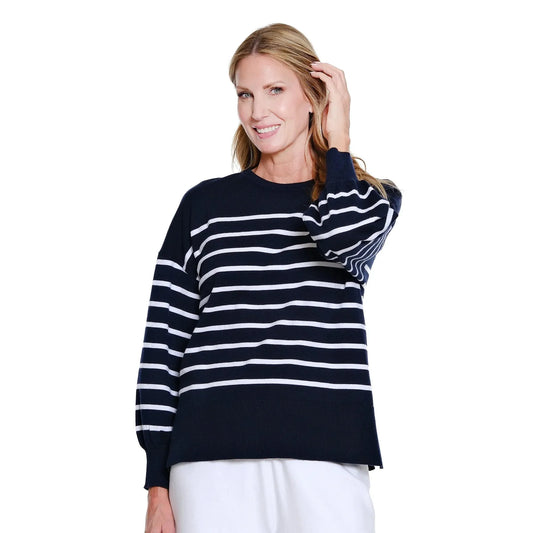 Woman wearing a black and white striped sweater on a white background