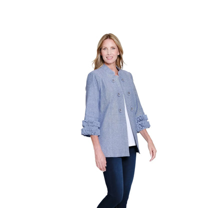 A woman wearing a Multiples brand 3/4 sleeve chambray blue jacket with a stand collar and double-button front, styled over a white top and navy pants.