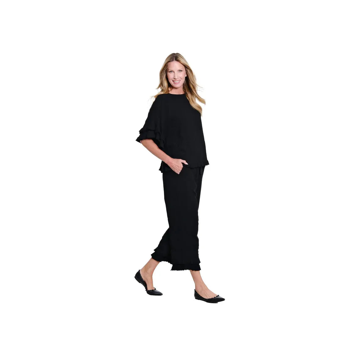 Multiples black pants showing the adjustable drawstring elastic waistband and front pocket detail.