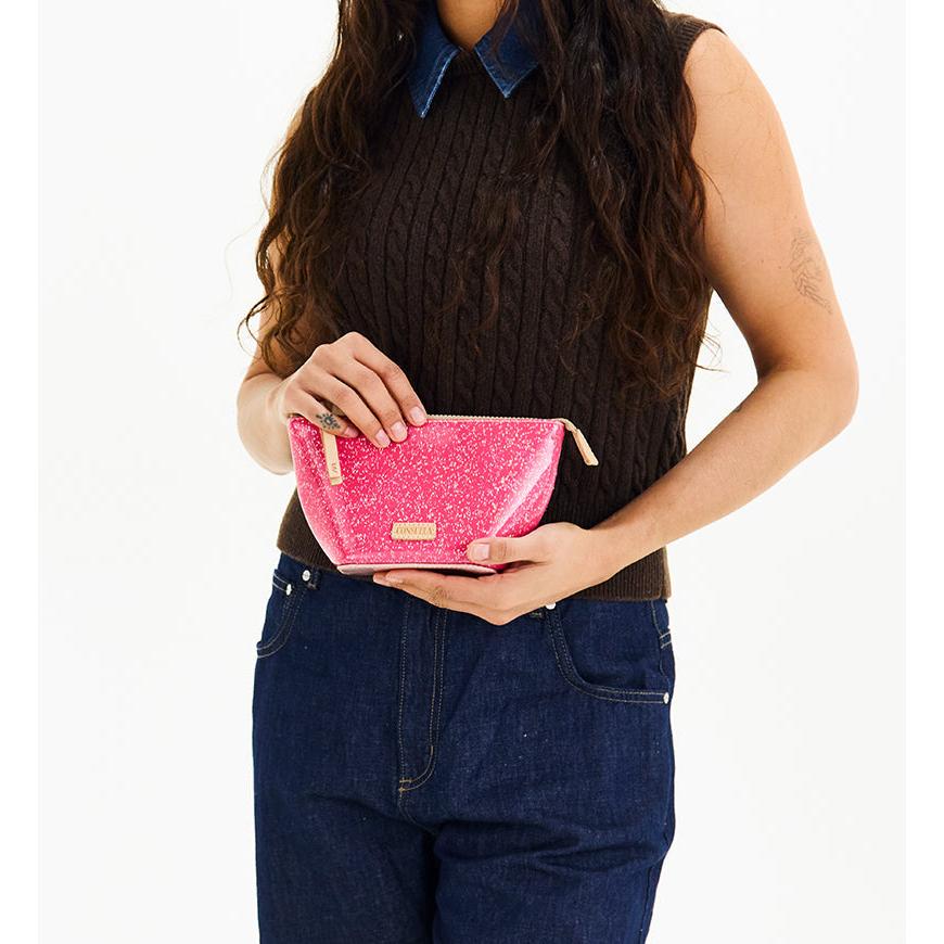 Consuela Bae Medium Tool Kit featuring a bright multicolored glitter exterior and a natural leather zipper pull.