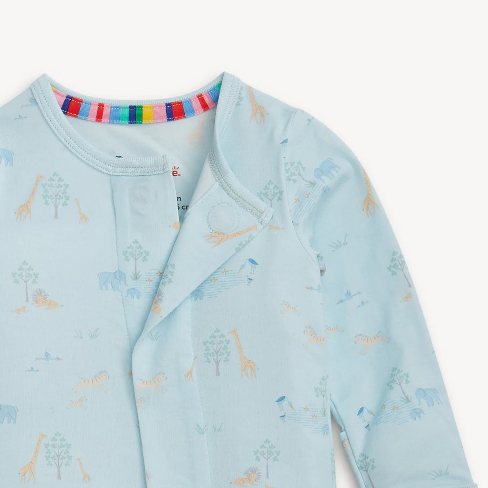 Close-up of the Blue Serene Safari footie neckline showing the hidden magnetic closure and the soft TENCEL modal fabric texture.