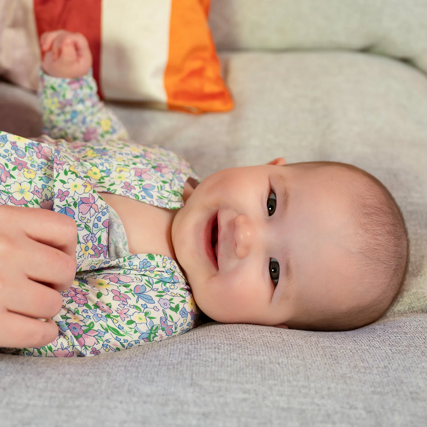 Close-up of the hidden magnetic closure and the TENCEL™ modal fabric texture on the Lavinia floral sleeper.