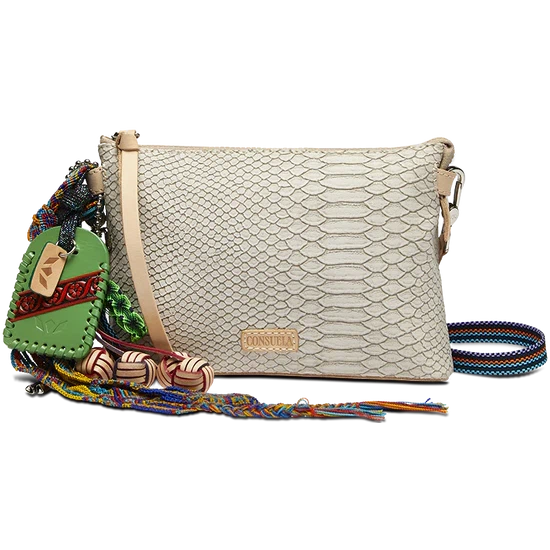 Consuela Thunderbird Midtown Crossbody featuring an embossed snake print exterior and colorful signature charms.