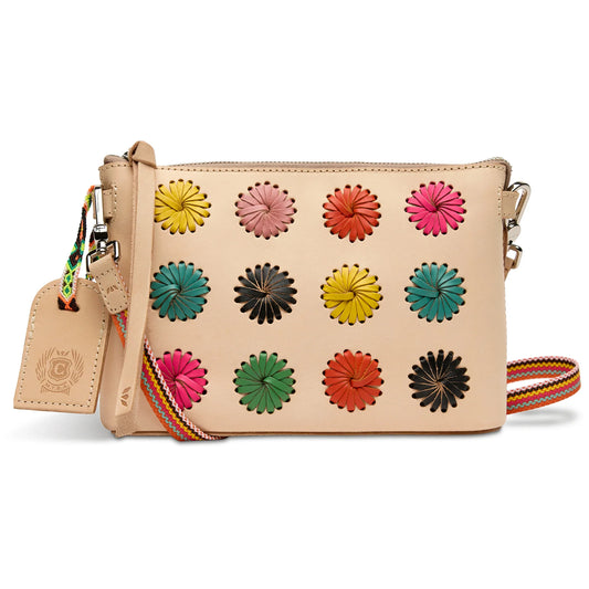 Consuela Paloma Midtown Crossbody featuring vibrant hand-laced multi-colored leather pinwheels on a Diego leather exterior.