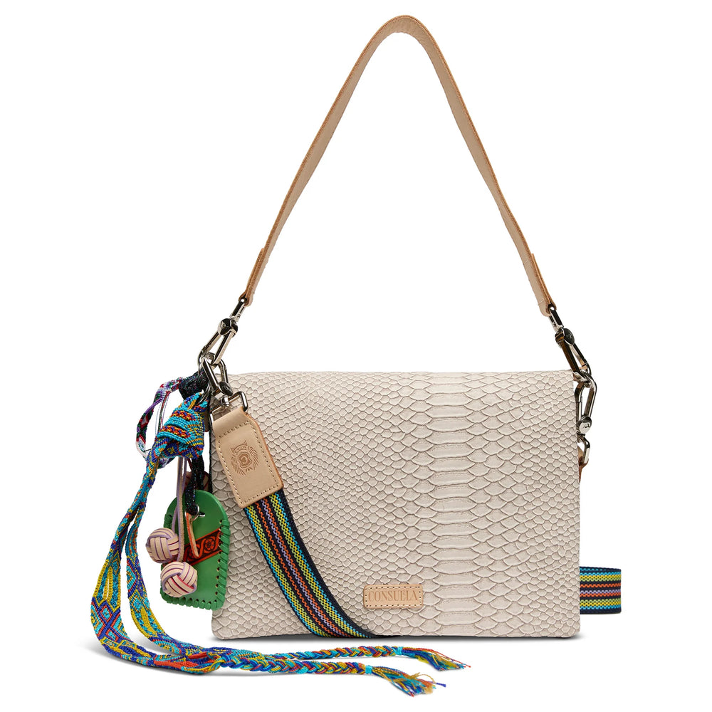 onsuela Thunderbird Metro Crossbody with a white reptile-textured exterior, vibrant Thunderbird design, and adjustable woven strap.