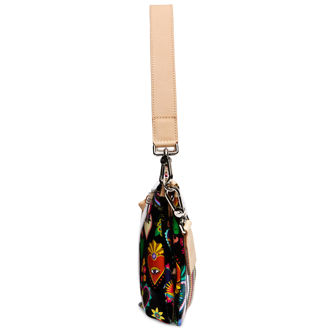 Consuela Vida Metro Crossbody side profile showing slim depth and tan leather handle