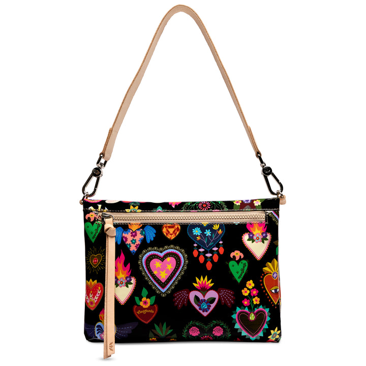 Consuela Vida Metro Crossbody front exterior zip pocket with leather zipper pull, heart print on black