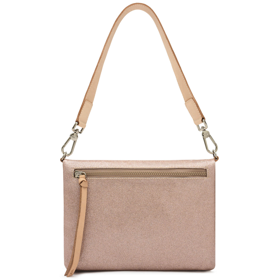 Back view of the Consuela Emery Metro Crossbody showing the blush glitter exterior and a back zip pocket.