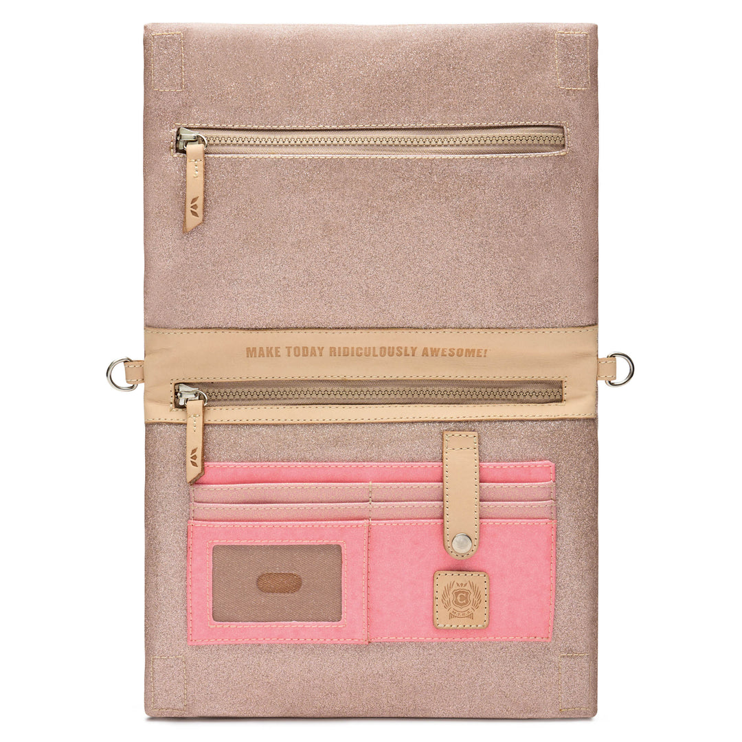 Consuela Emery Metro Crossbody shown open, revealing an interior zip pocket stamped Make Today Ridiculously Awesome, pink card slots, and a clear ID window.