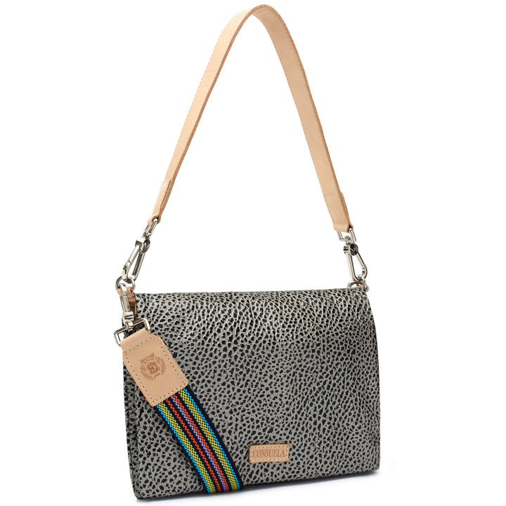 Consuela Tommy Metro Crossbody angled front view with tan leather shoulder strap and rainbow-striped crossbody strap