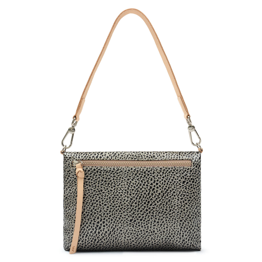 Consuela Tommy Metro Crossbody back view showing exterior zip pocket and adjustable strap, gray and black pebble print