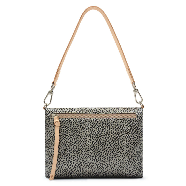 Consuela Tommy Metro Crossbody back view showing exterior zip pocket and adjustable strap, gray and black pebble print