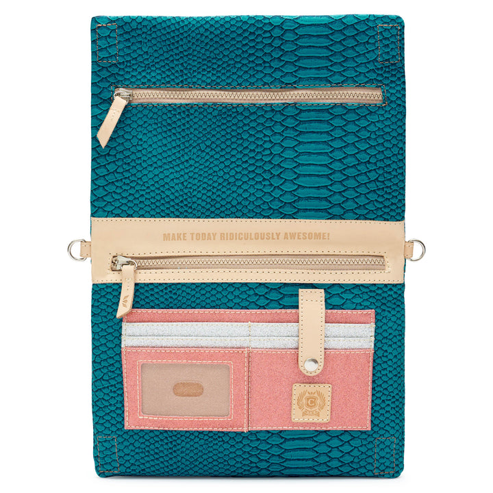Consuela Indy Metro Crossbody shown open, revealing an interior zip pocket stamped Make Today Ridiculously Awesome, pink card slots, and a clear ID window.