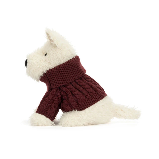 Jellycat Munro Scottie Dog plush wearing a cozy knitted winter jumper — a soft, shaggy Scottie dog.