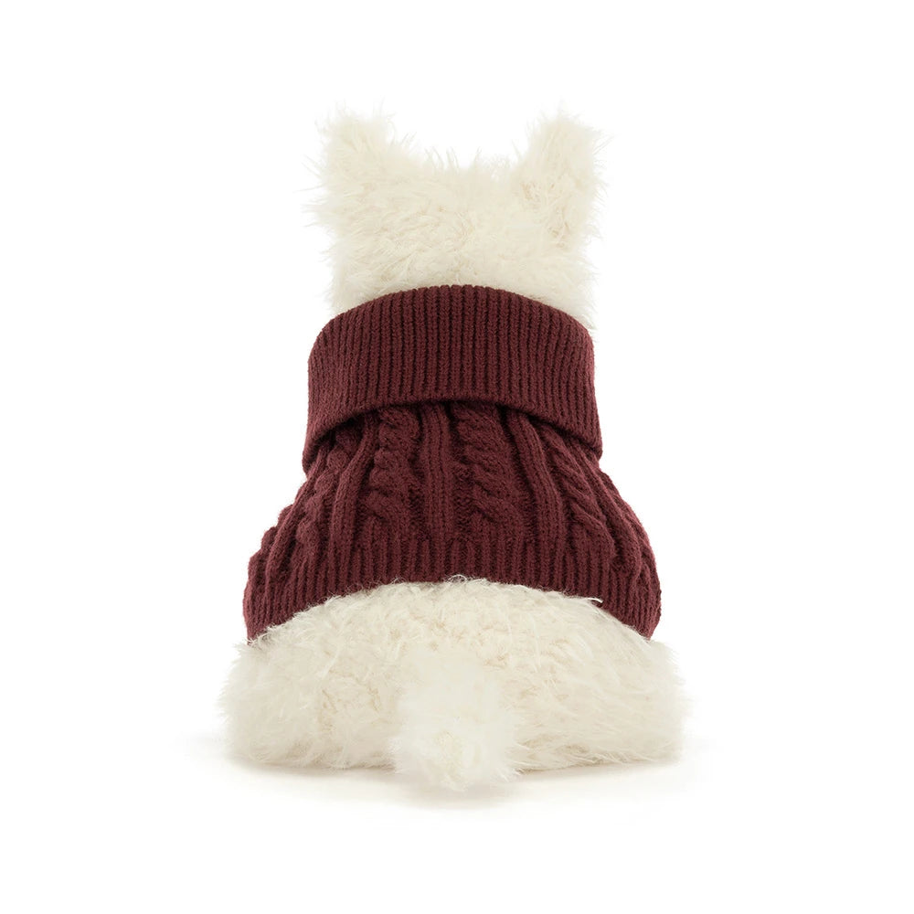 Jellycat Munro Scottie Dog plush wearing a cozy knitted winter jumper — a soft, shaggy Scottie dog.