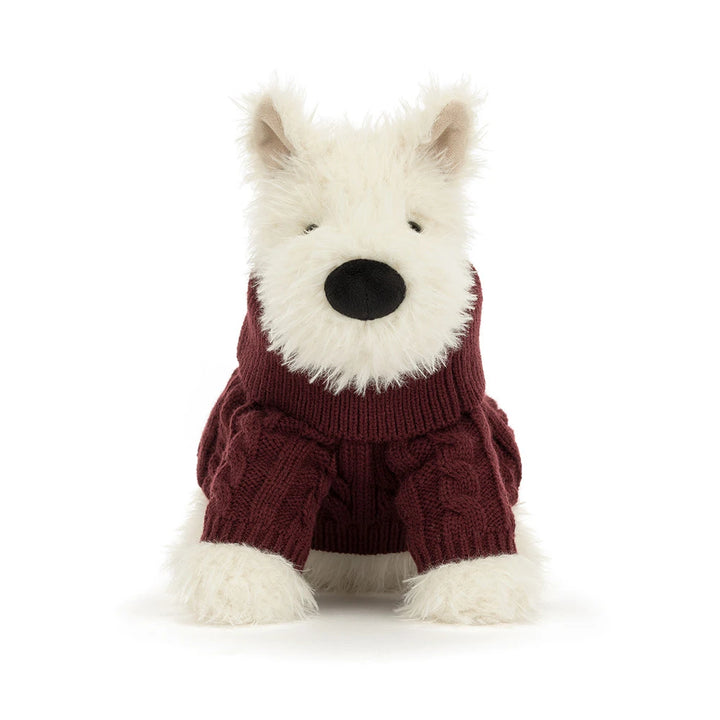Jellycat Munro Scottie Dog plush wearing a cozy knitted winter jumper — a soft, shaggy Scottie dog.