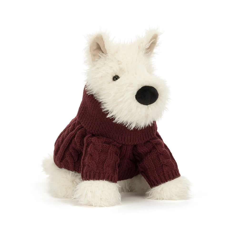Jellycat Munro Scottie Dog plush wearing a cozy knitted winter jumper — a soft, shaggy Scottie dog.