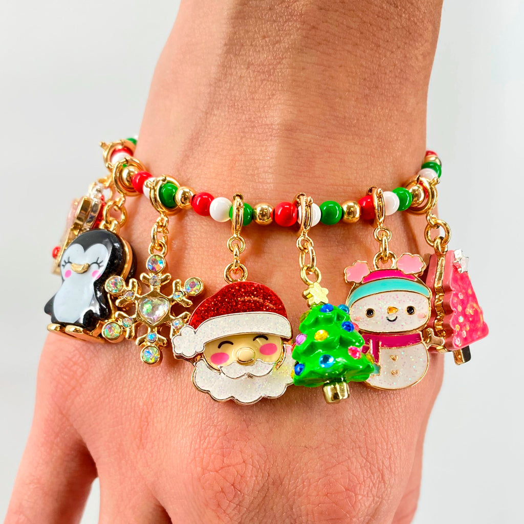 Charm It Gold Glitter Santa Claus charm on a gold Christmas stretch bead bracelet for girls
