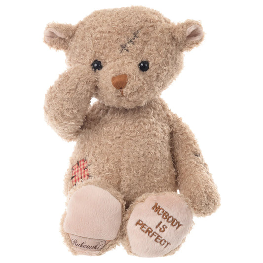 11-inch blonde plush bear named "Nobody is Perfect" featuring a stitched scar on its head and side.