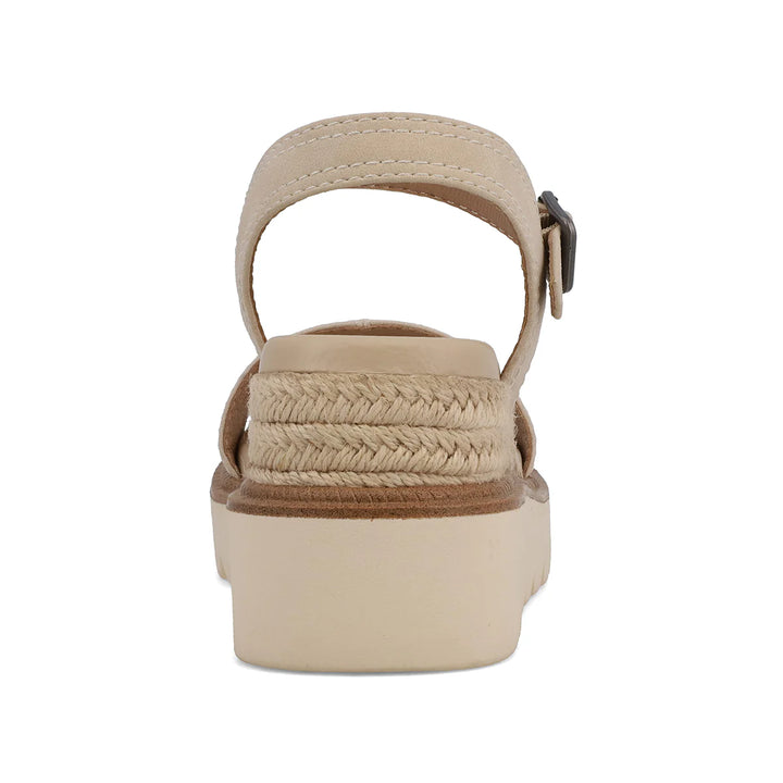 Close-up of the contoured MIA Signature Footbed and adjustable buckle closure on the Ecru Ophidia sandal.