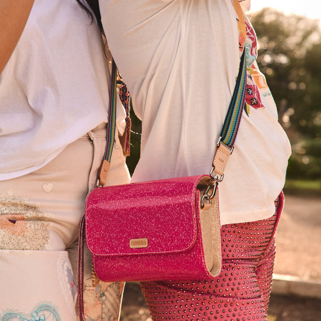 Consuela Bae On The Town mini messenger bag featuring a multicolored glitter exterior.