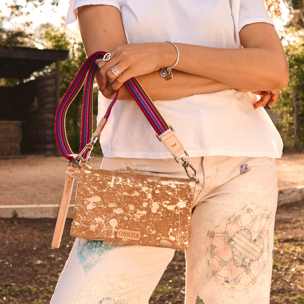Consuela Marlow Uptown Crossbody bag featuring a metallic hand-splattered leather suede exterior.