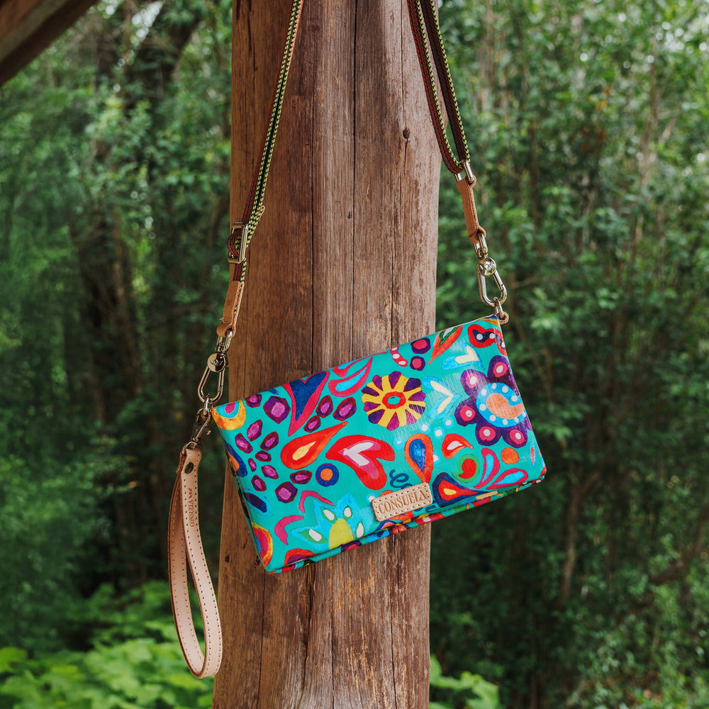 Consuela Tasha Uptown Crossbody bag featuring a colorful floral ConsuelaCloth exterior.
