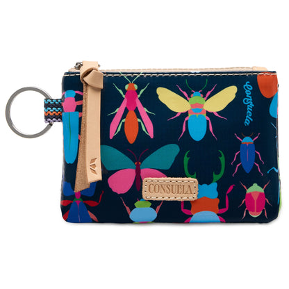 Consuela Gemma Pouch in navy blue with a colorful bug pattern and a natural leather logo accent and zipper pull.
