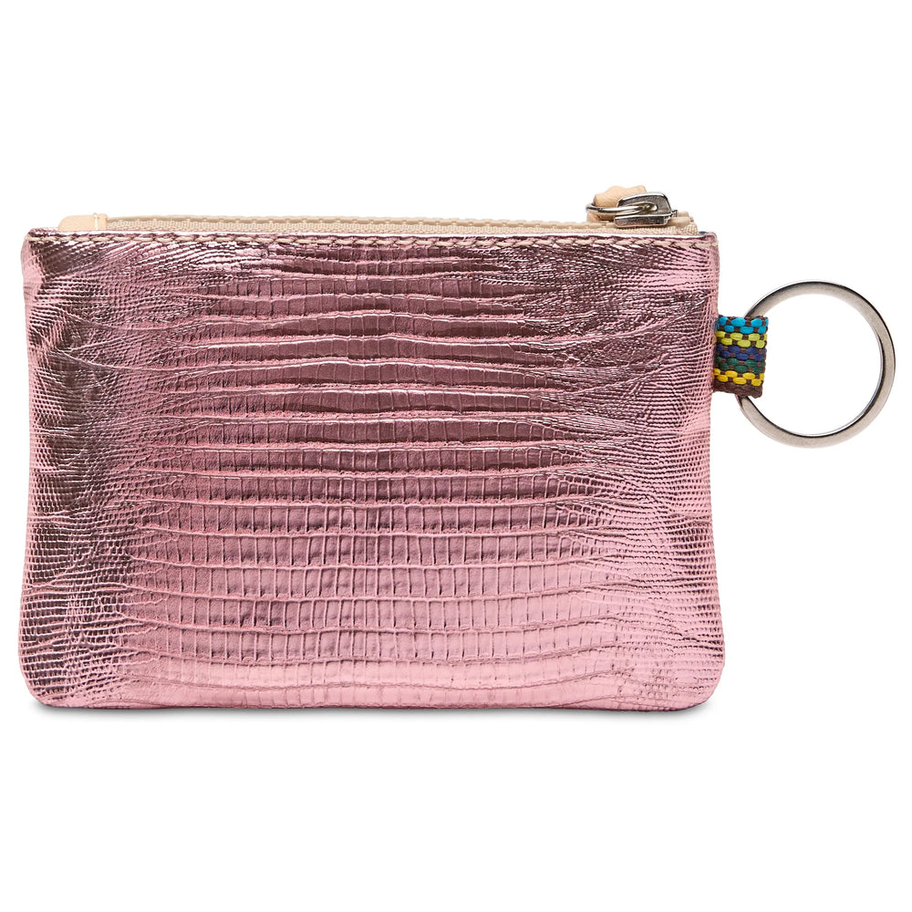 Close-up of the metallic pink snake-print texture and the colorful woven zipper pull on the Elodie Pouch