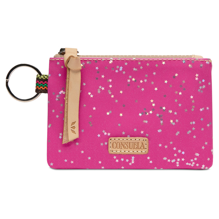 Consuela Berry pink zippered pouch with a scattered silver and white star pattern, featuring a natural leather tab and a colorful woven strap attached to a silver key ring.