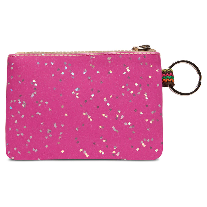 Showing the back of the Consuela Berry  pouch, decorated with scattered silver, gold, and white star confetti, featuring a gold zipper and a metal key ring attached on the  side.