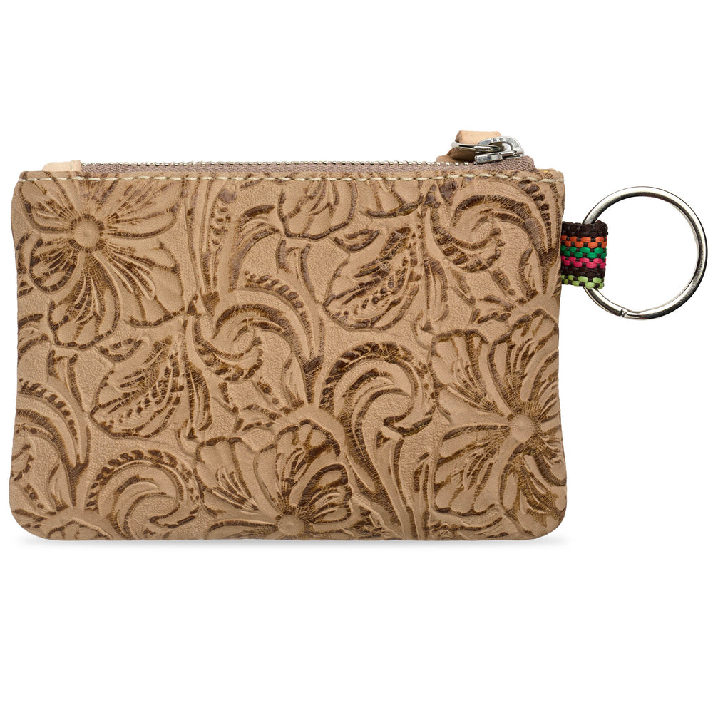 leather zip Back view of Consuela Lawton pouch with an embossed floral pattern, featuring a silver metal key ring and a colorful woven strap on the right side, set against a plain white background.
