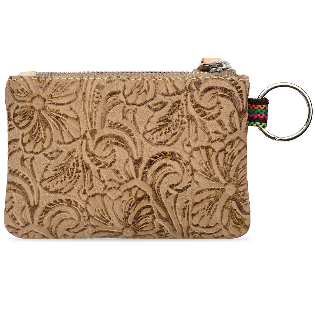 leather zip Back view of Consuela Lawton pouch with an embossed floral pattern, featuring a silver metal key ring and a colorful woven strap on the right side, set against a plain white background.