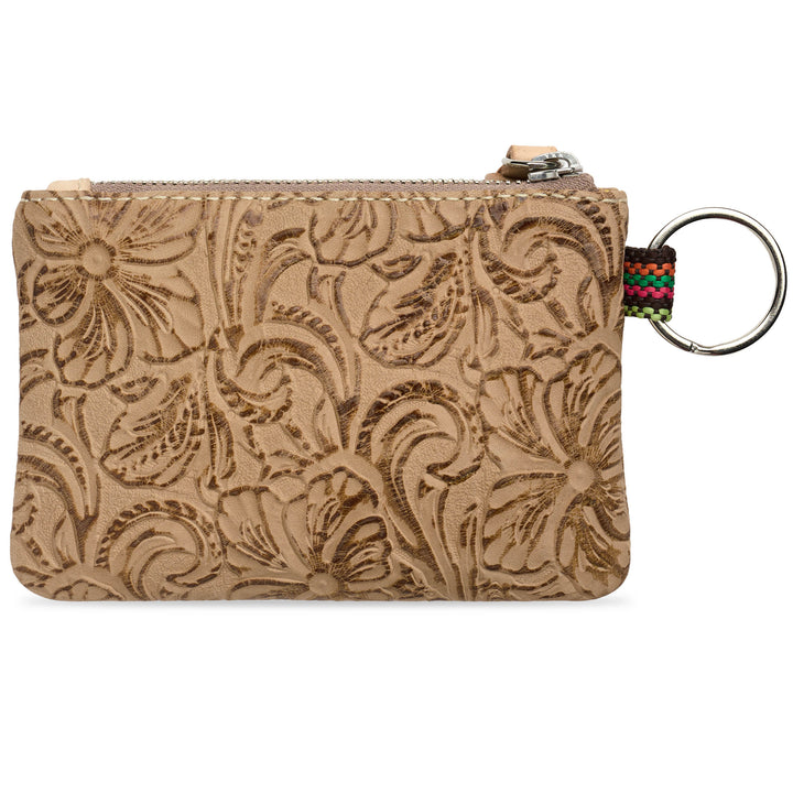 leather zip Back view of Consuela Lawton pouch with an embossed floral pattern, featuring a silver metal key ring and a colorful woven strap on the right side, set against a plain white background.