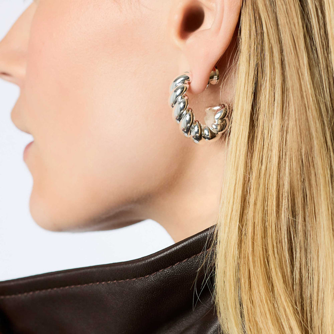 Julie Vos Ravello twisted silver hoops worn by model