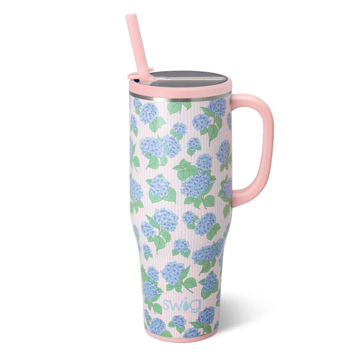 40oz insulated Mega Mug by Swig Life featuring a blue and pink hydrangea print with a comfort-grip handle and straw.