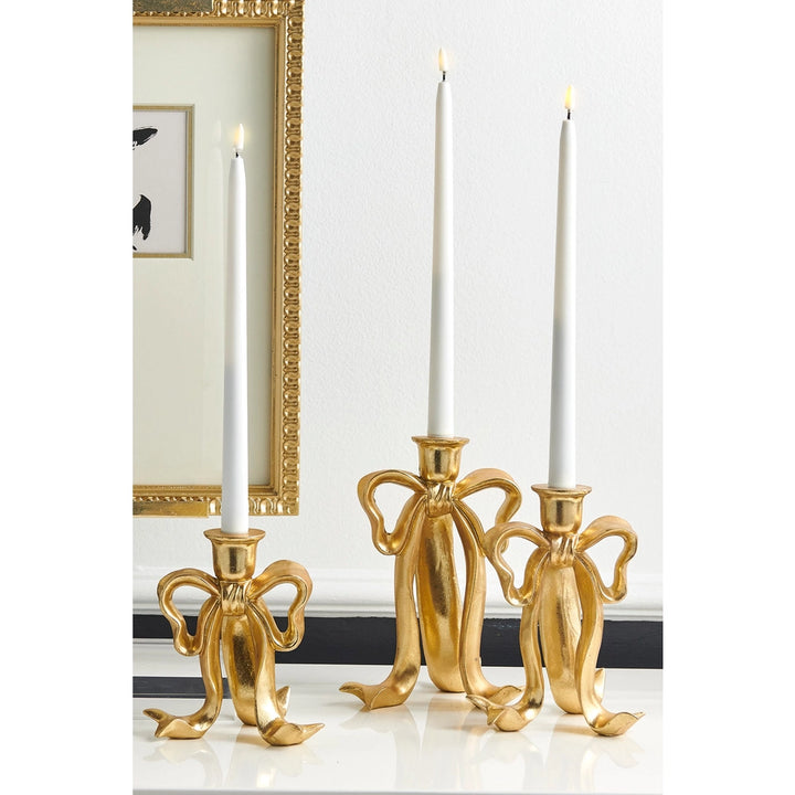 RAZ 9" Bow Candlesticks set of three featuring an elegant gold bow design.
