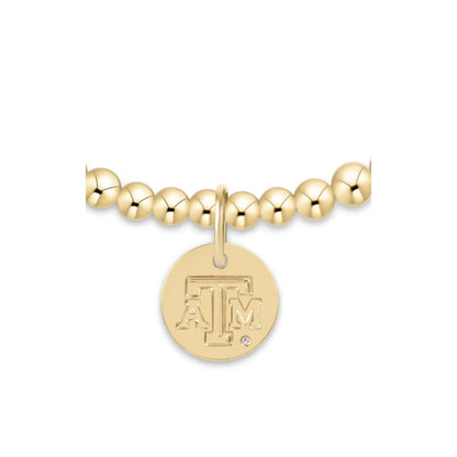 enewton Classic Gold 3mm Bracelet with a Texas A&M gold disc; an officially licensed gold-filled beaded bracelet for Aggie fans.