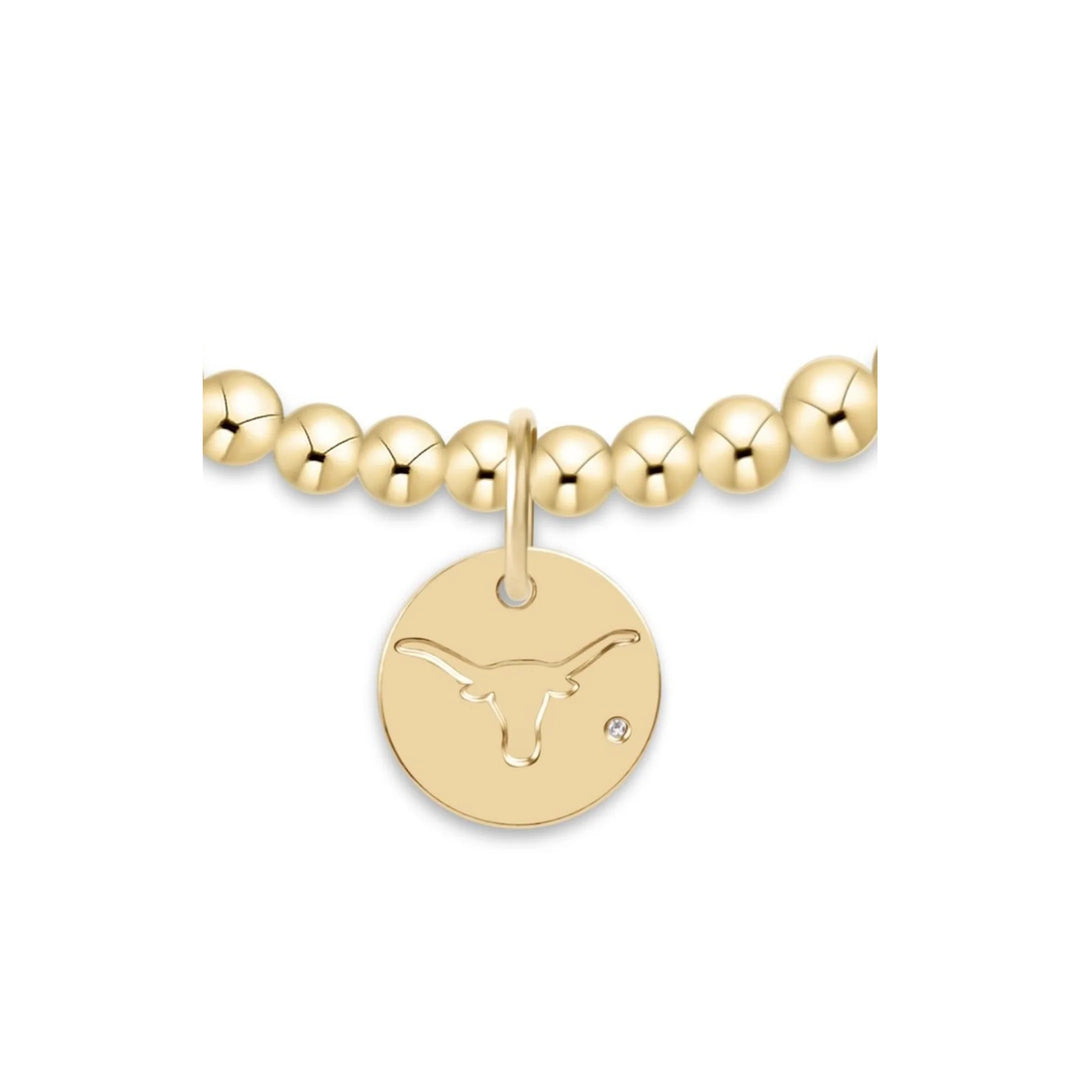 enewton Classic Gold 3mm Bracelet with a Texas Longhorns gold disc; an officially licensed gold-filled beaded bracelet for University of Texas fans.