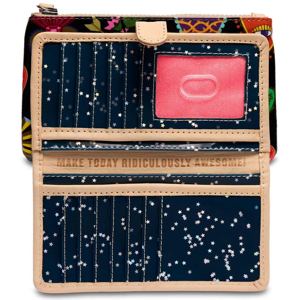 Open Consuela Vida Slim Wallet interior with navy star-confetti lining, card slots, and a clear ID window