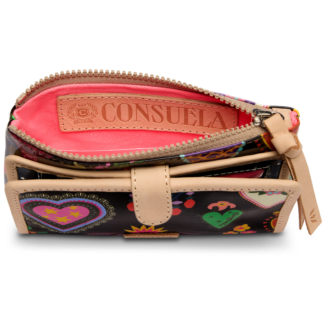 Consuela Vida Slim Wallet zip-top pocket open, showing coral lining and embossed Consuela leather patch