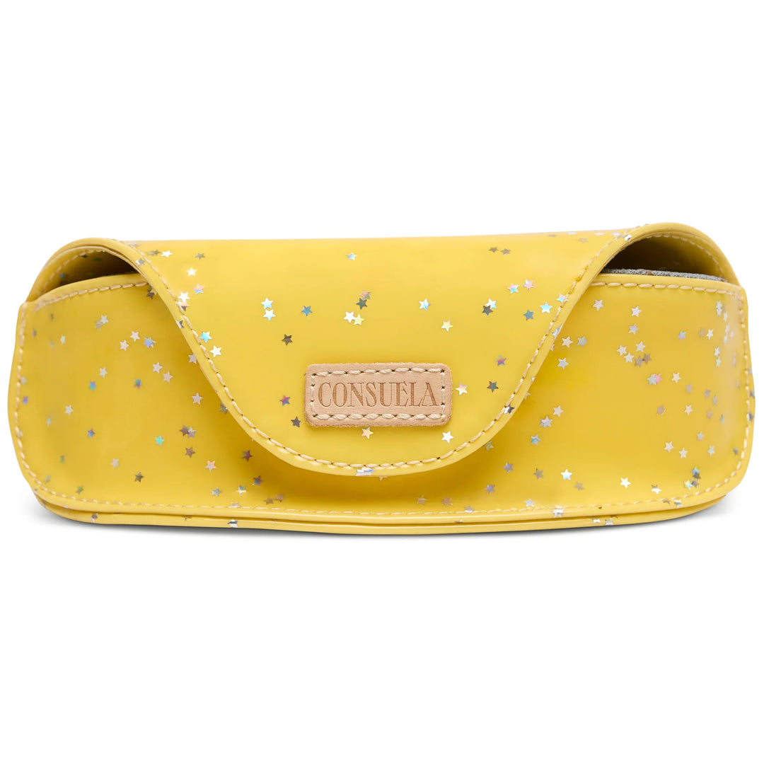 Consuela Harlow Sunglass Case; a structured yellow glitter eyewear case with iridescent stars and natural leather accents.