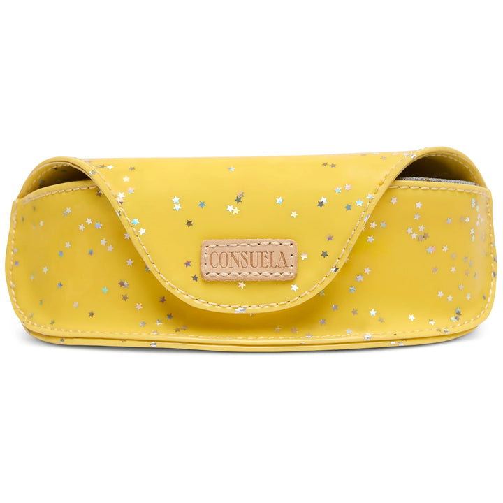 Consuela Harlow Sunglass Case; a structured yellow glitter eyewear case with iridescent stars and natural leather accents.