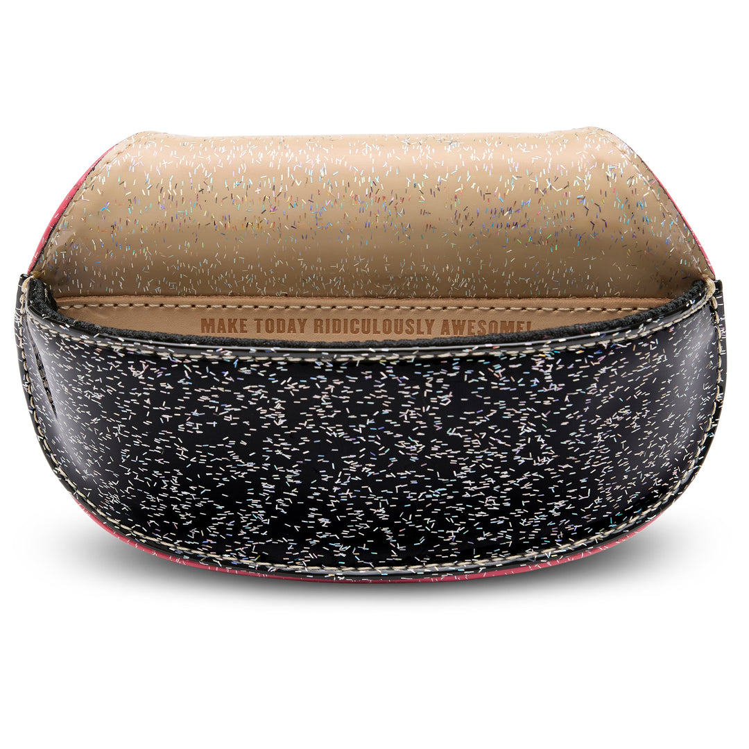 Consuela Bae Sunglass Case featuring a multicolored glitter exterior and natural leather logo patch.