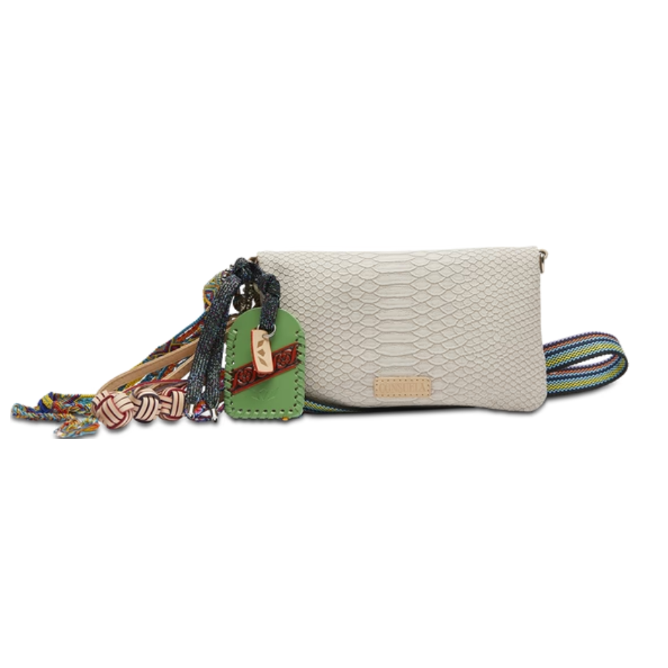 Consuela Thunderbird Uptown Crossbody bag featuring colorful patterns, a detachable wristlet, and natural leather trim.